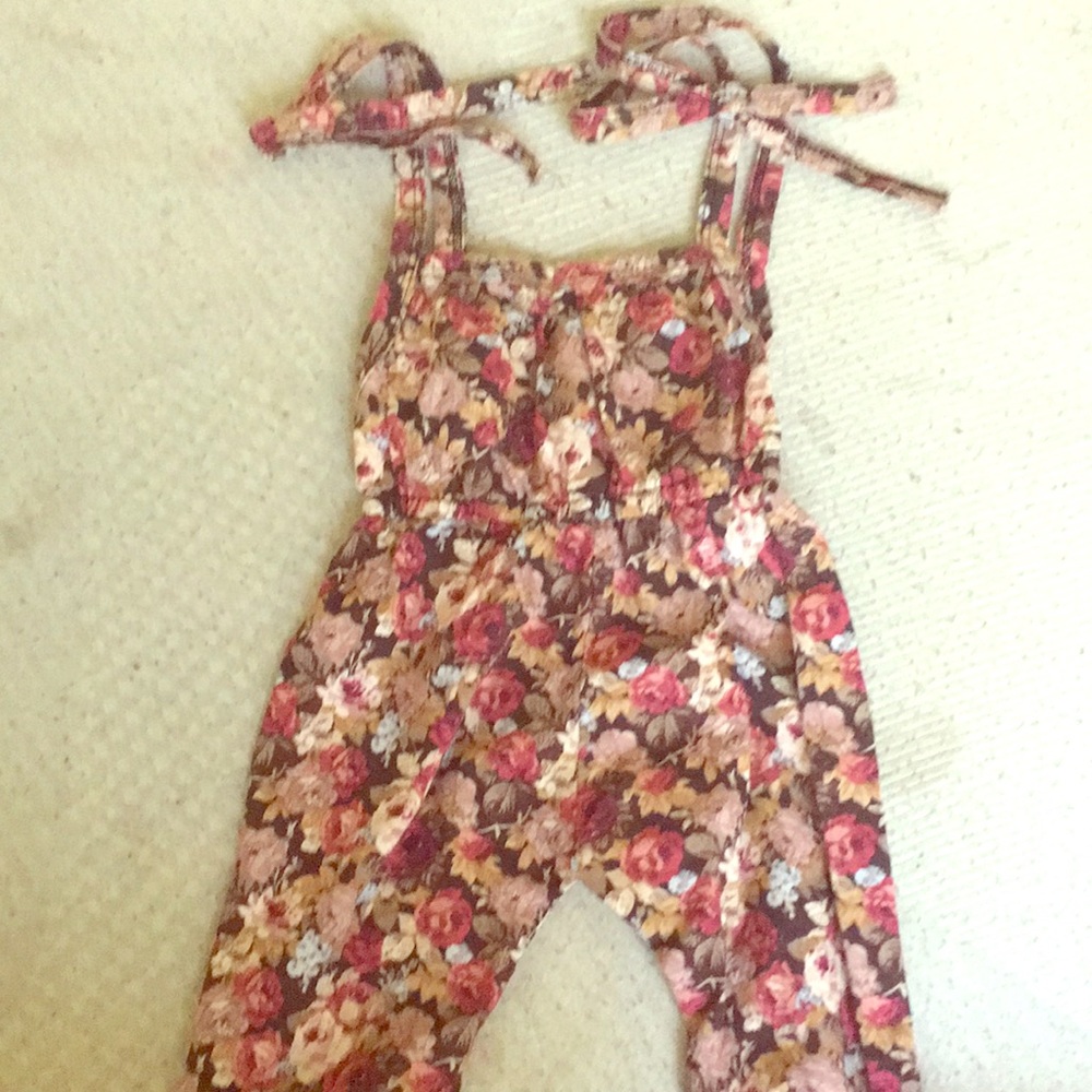 A rumper with flowers design on it
